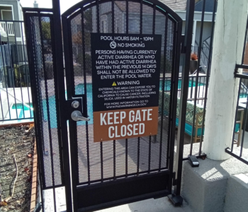 Keep Gate CLosed sign installed on metal gate.